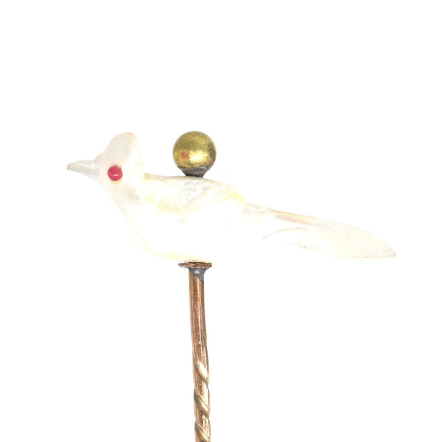 Victorian Baroque pearl tie pin shaped like a bird with a gold ball detail, showcasing unique freshwater Keshi pearl craftsmanship.