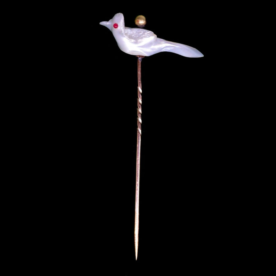 Victorian Baroque pearl tie pin shaped like a bird, featuring unique Keshi pearl design and red gemstone eye.