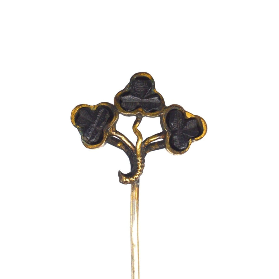 Victorian Irish bog oak tie pin featuring a trio of hand-carved shamrocks, symbolizing heritage and sentimentality.