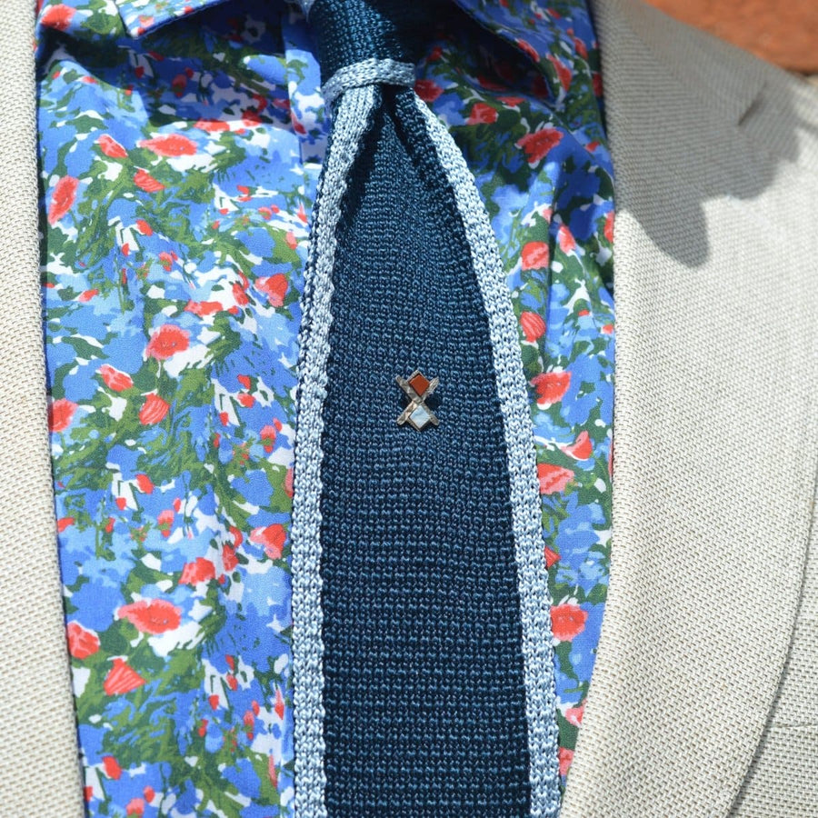 Victorian Scottish silver St Andrews cross tie pin with jasper and agate on a green tie and floral shirt.