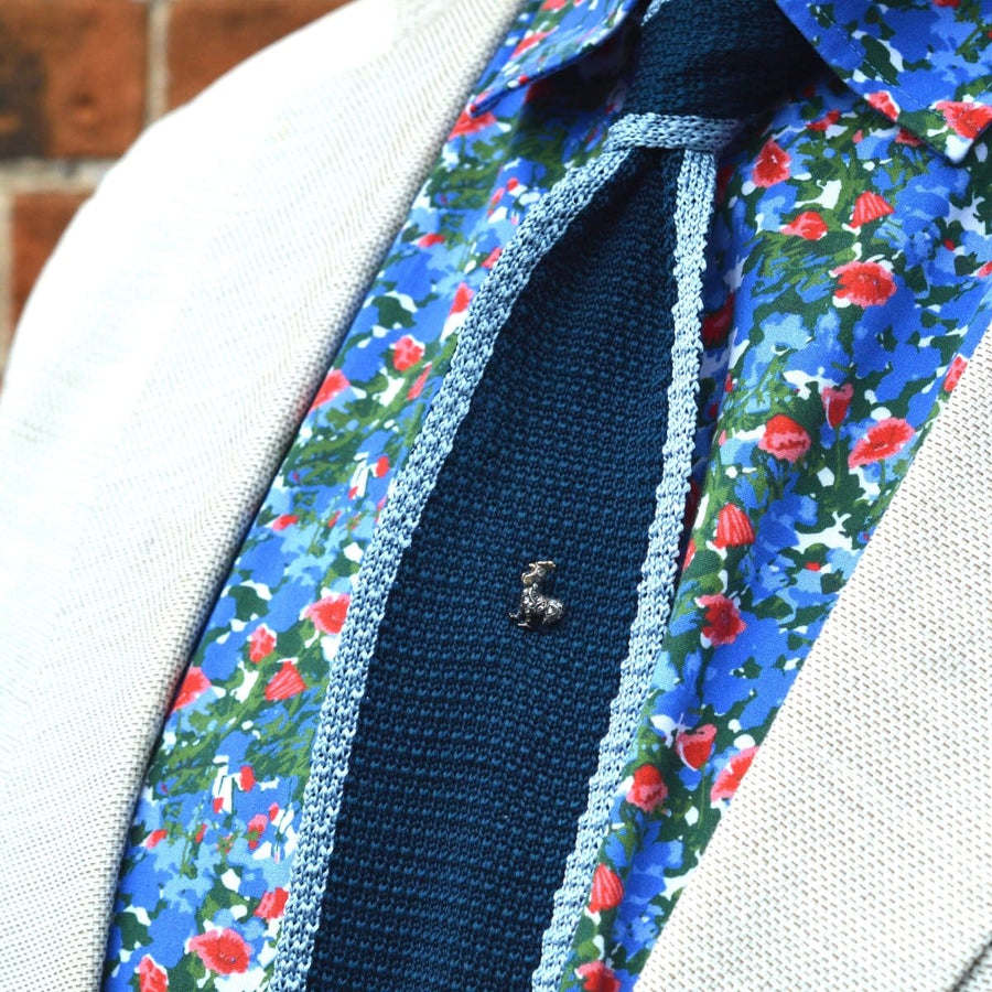 Victorian silver diamond cockerel tie pin showcased on a stylish floral shirt with a textured tie.