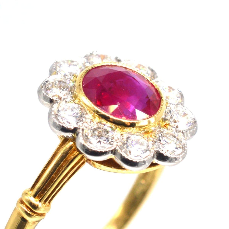 Vintage 18ct gold cluster ring featuring natural Burma ruby surrounded by ten sparkling diamonds.