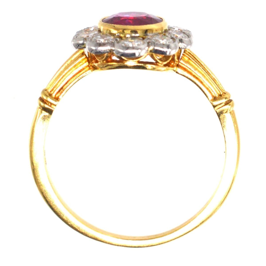 Vintage 18ct gold cluster ring featuring natural Burma ruby and ten diamond accents, ideal for engagement or July birthdays.