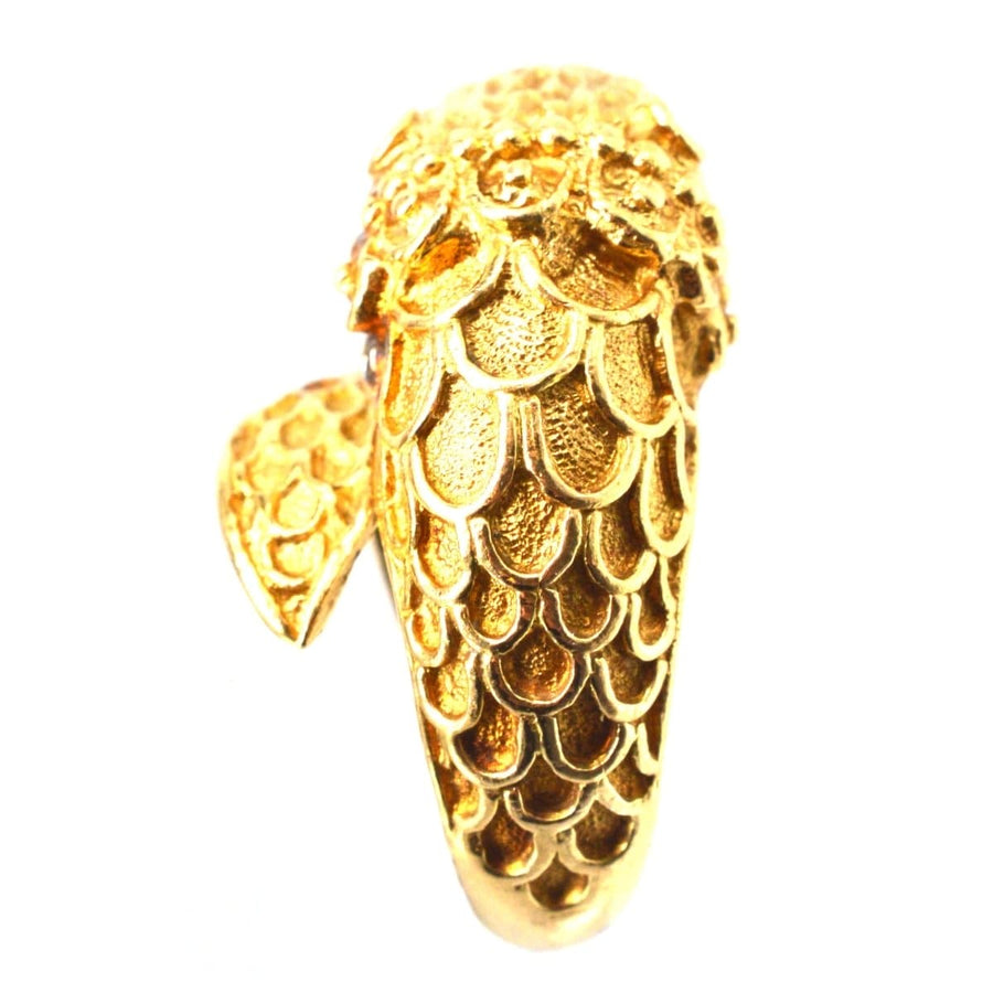 Vintage 18ct gold chimera ring with intricate scales and design, featuring ruby eyes, inspired by Greek jewelry.