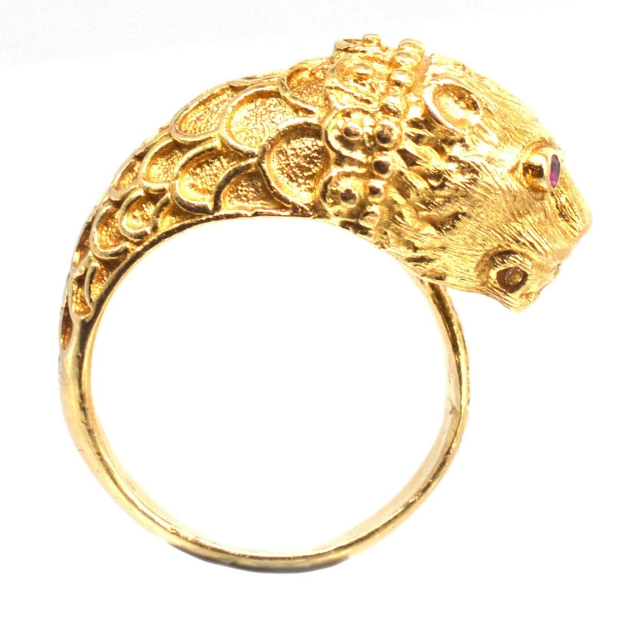 Vintage 18ct gold chimera ring featuring ruby eyes, inspired by Greek designer Ilias Lalaounis.