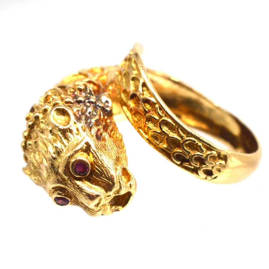 Vintage 18ct gold chimera ring featuring ruby eyes, inspired by Greek designer Ilias Lalaounis.