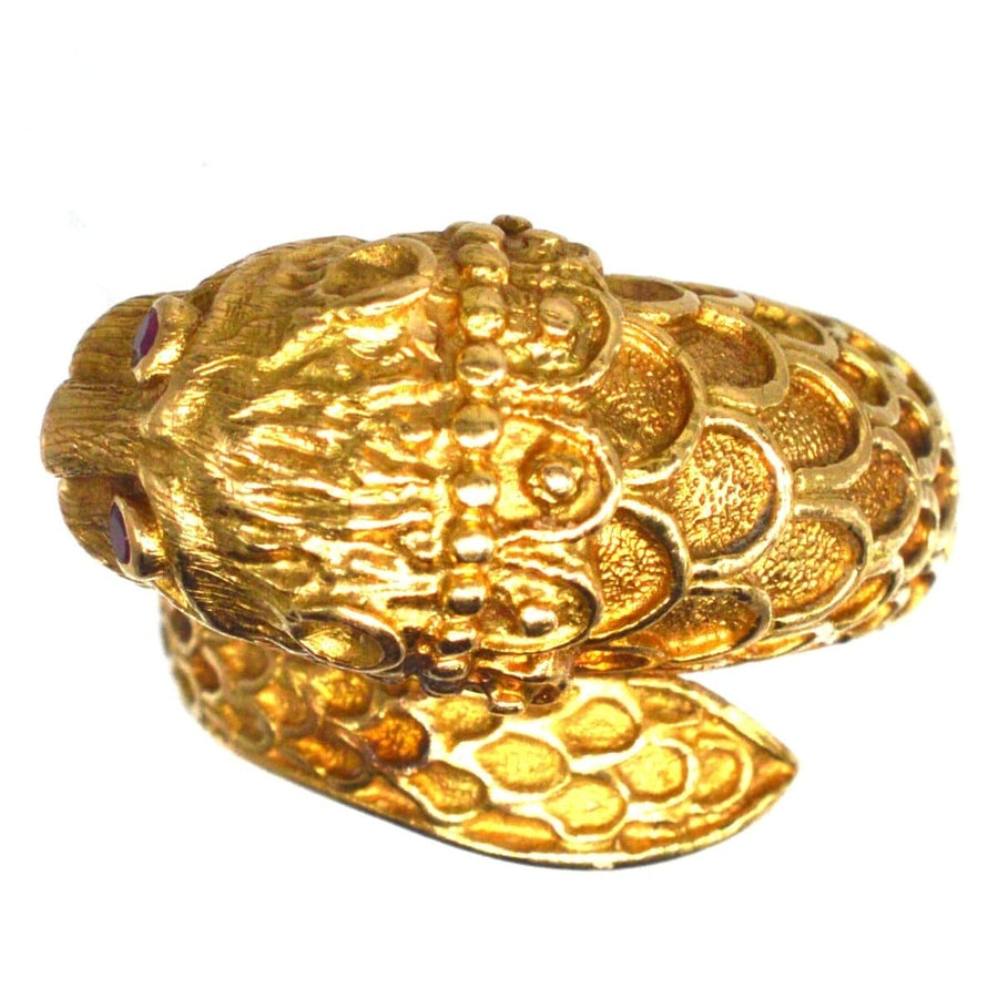 Vintage 18ct gold chimera ring featuring ruby eyes in a Lalaounis-inspired design.