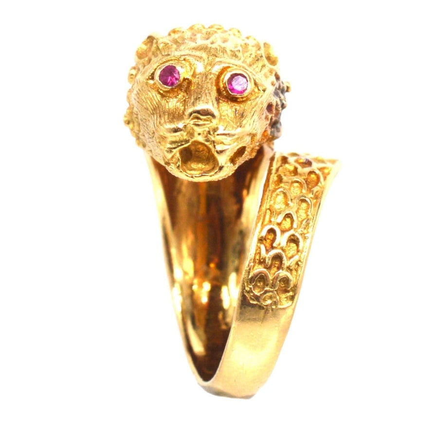 Vintage 18ct gold Chimera ring featuring a lion head and ruby eyes, inspired by Greek designer Lalaounis.