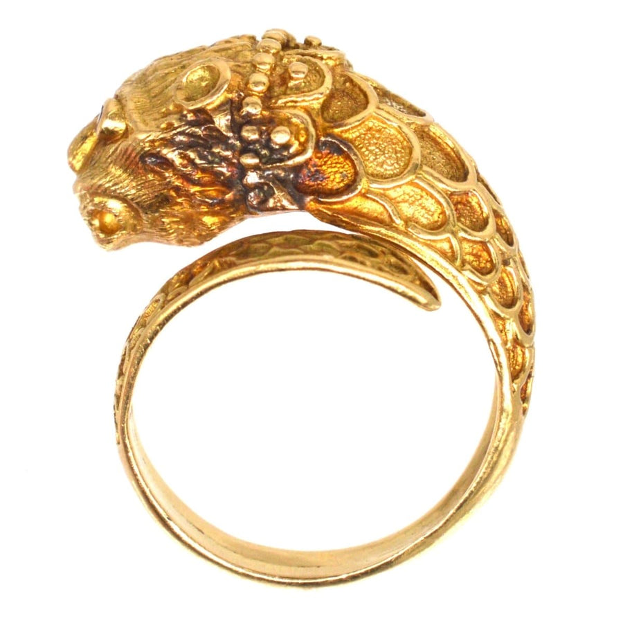 Vintage 18ct gold chimera ring with intricate detailing and ruby eyes, inspired by Greek designer Lalaounis.