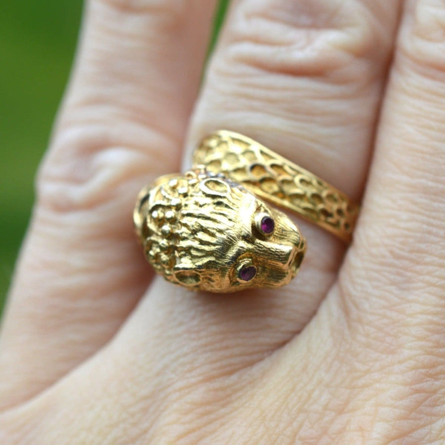 Vintage 18ct gold chimera ring featuring ruby eyes, inspired by Greek designer Ilias Lalaounis.