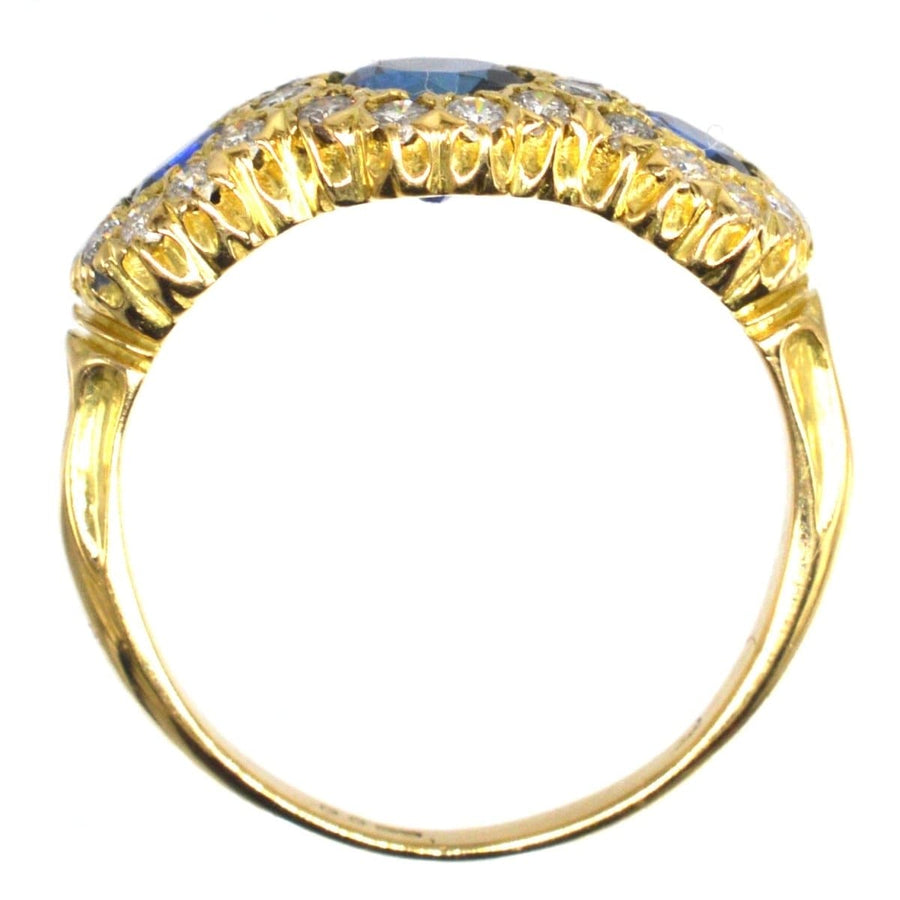 Vintage 18ct gold sapphire and diamond triple cluster ring, elegant design from 1975, perfect for engagements or anniversaries.