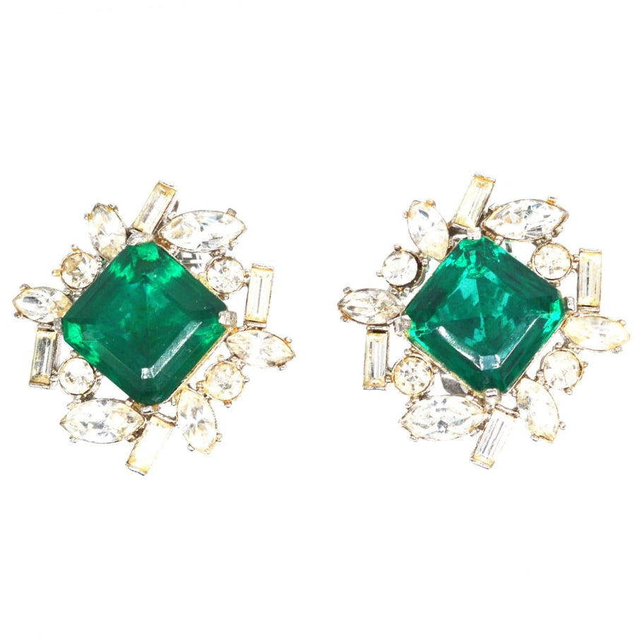 Vintage 1990s Kenneth Lane clip-on earrings featuring green paste stone and white paste cluster.