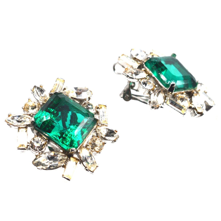 Vintage 1990s Kenneth Lane green and white paste clip-on earrings with emerald stone and cluster design.