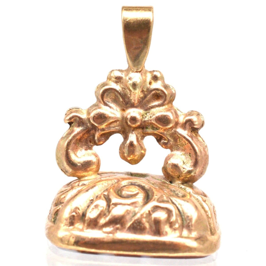 Vintage 9ct gold banded agate seal pendant with intricate floral design, perfect for antique jewelry lovers.