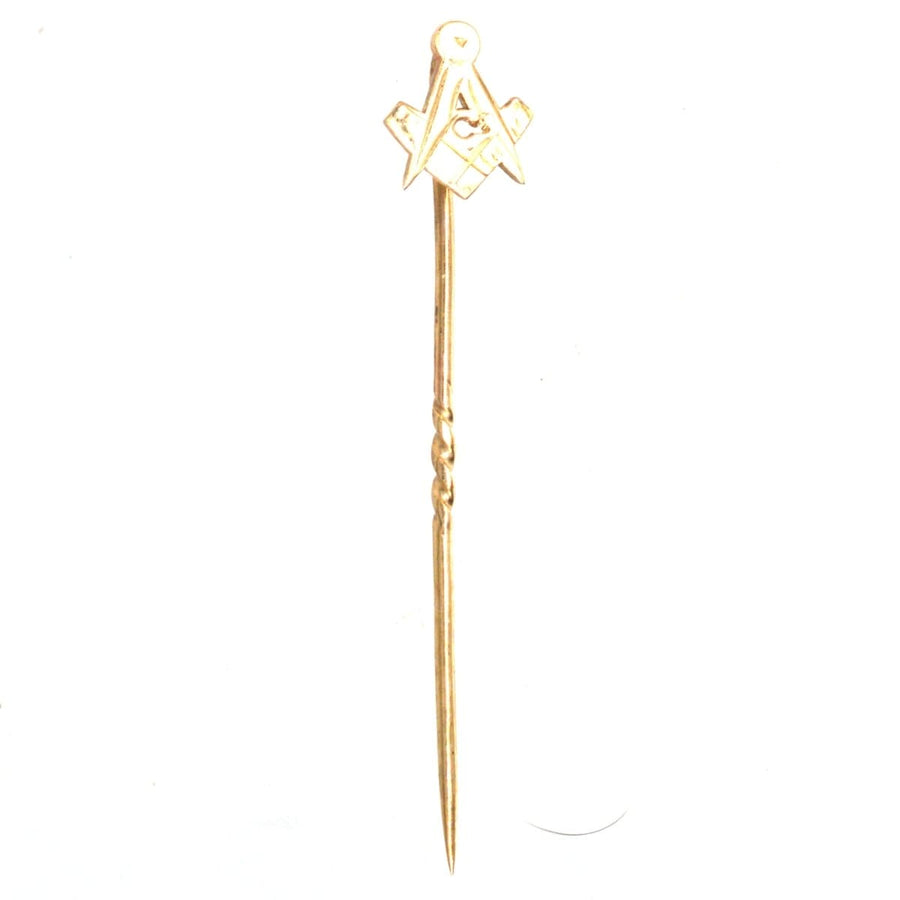 Vintage 9ct gold Masonic tie pin featuring compass and square symbols for Freemasons' moral values.