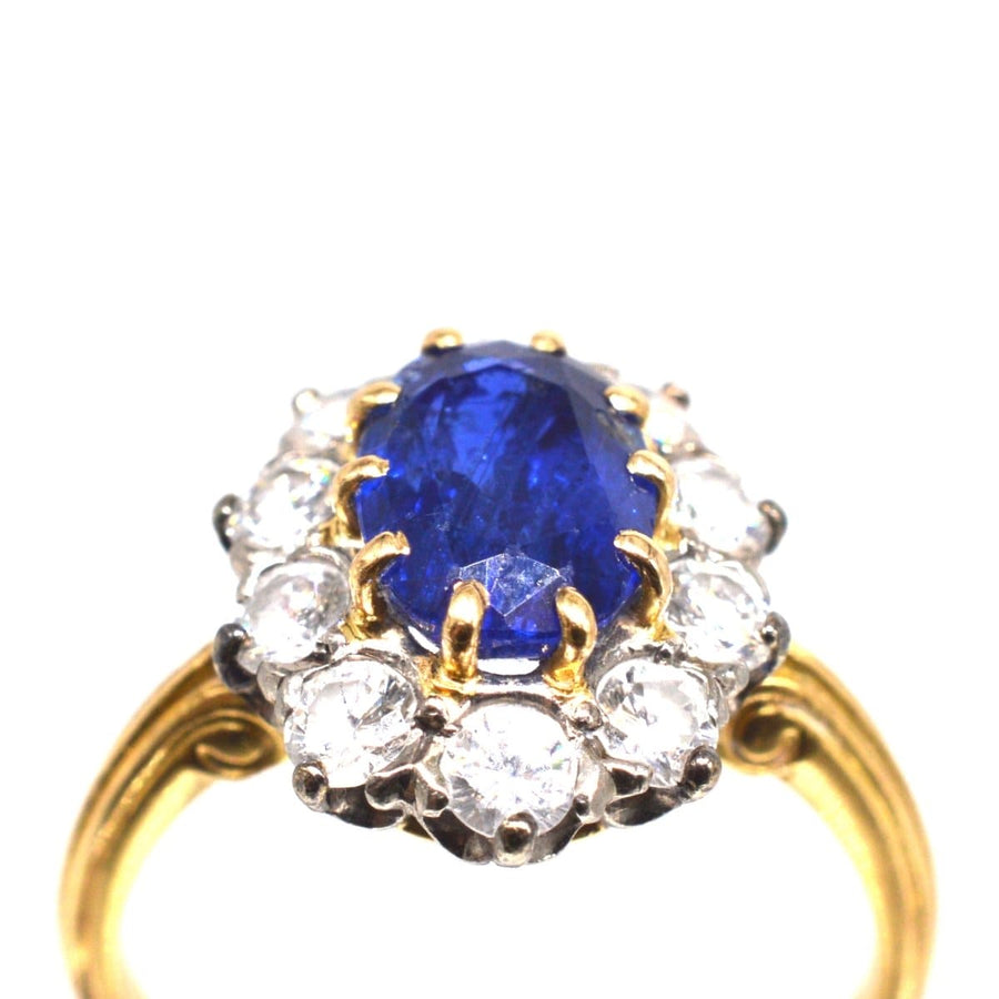Vintage 1960s 18ct gold sapphire and diamond cluster ring featuring royal blue sapphire and sparkling diamonds.