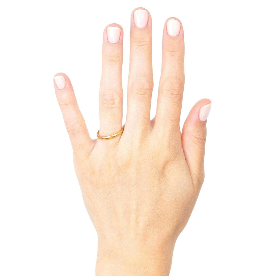 1940s 9ct gold wedding ring worn on hand, showcasing its simple design and comfortable fit.