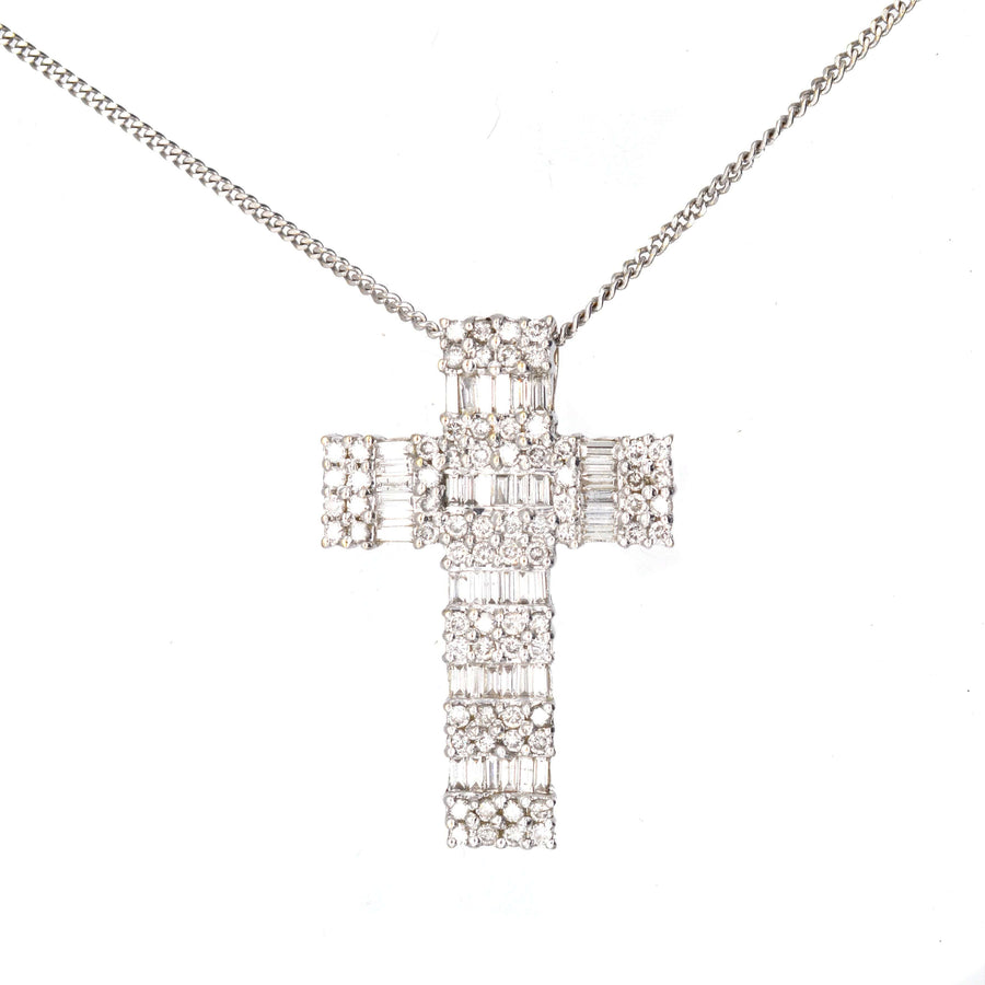 Vintage 1990s 18ct white gold diamond cross pendant with 3 carats of baguette and round diamonds.