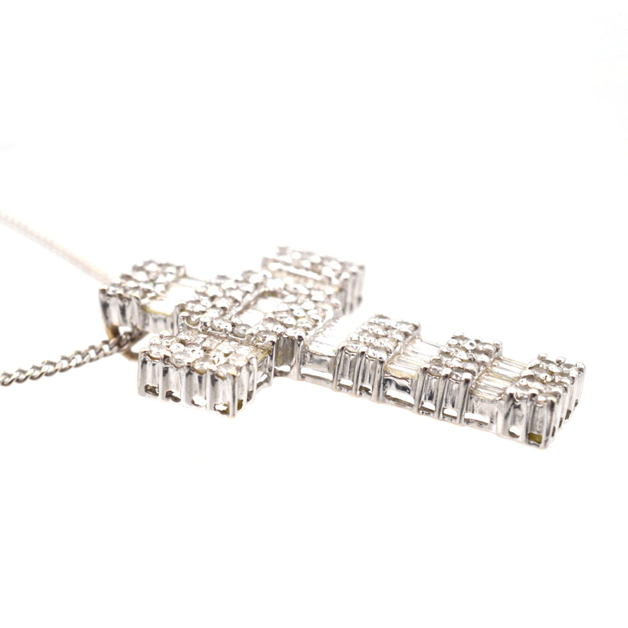 Vintage 1990s 18ct white gold cross pendant with 3 carats of diamonds, featuring beautiful baguette and round brilliant cuts.