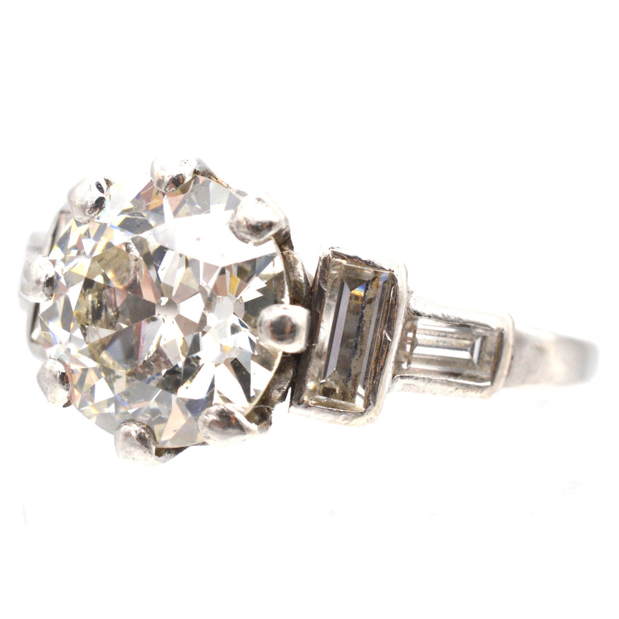 Art Deco platinum ring featuring a 2.3 carat Old European cut diamond and baguette diamond shoulders.