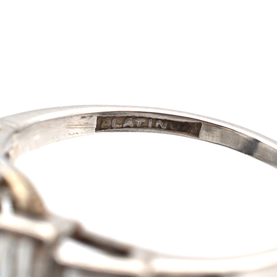 Close-up of the interior engraving of a platinum ring, showing the word 'PLATINUM' clearly.