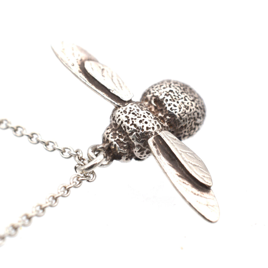 Modern Alex Monroe silver bumblebee pendant necklace, featuring intricate detailing and a delicate chain.