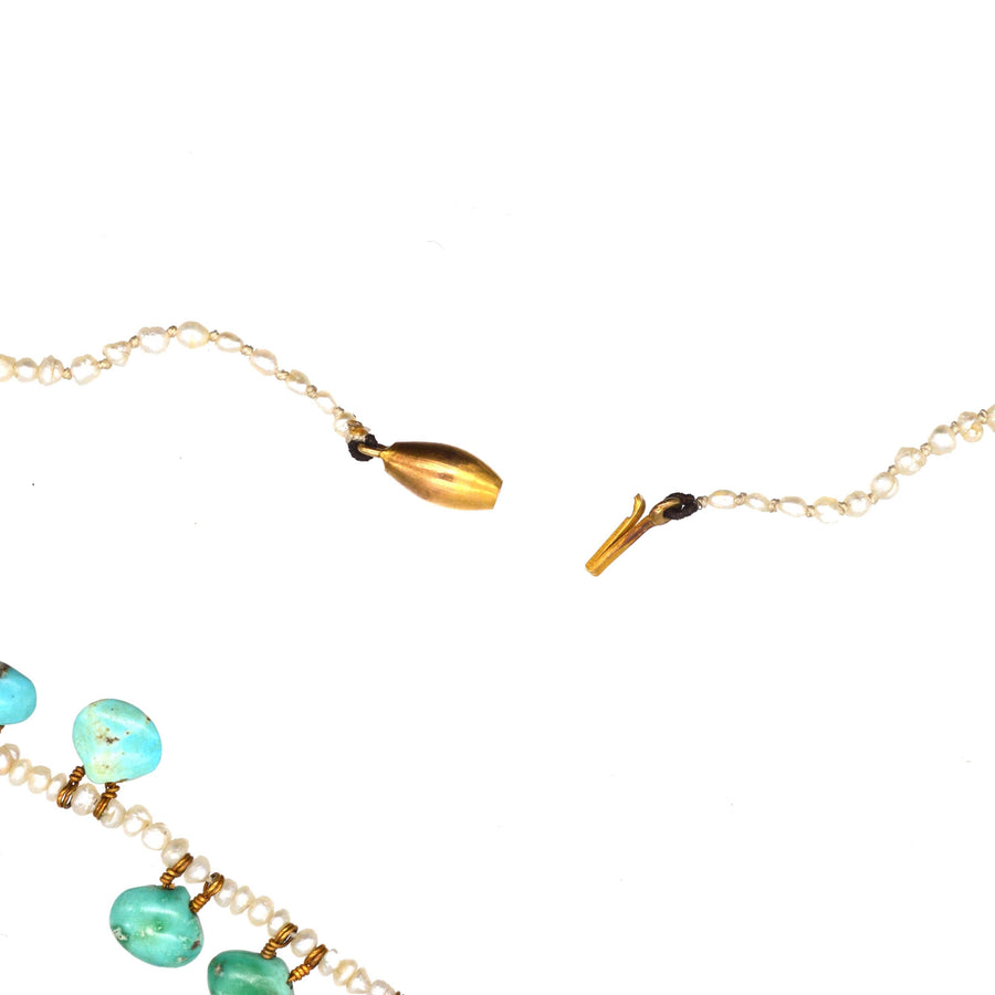 Close-up of an Edwardian turquoise and seed pearl necklace, showcasing the clasp and intricate details.