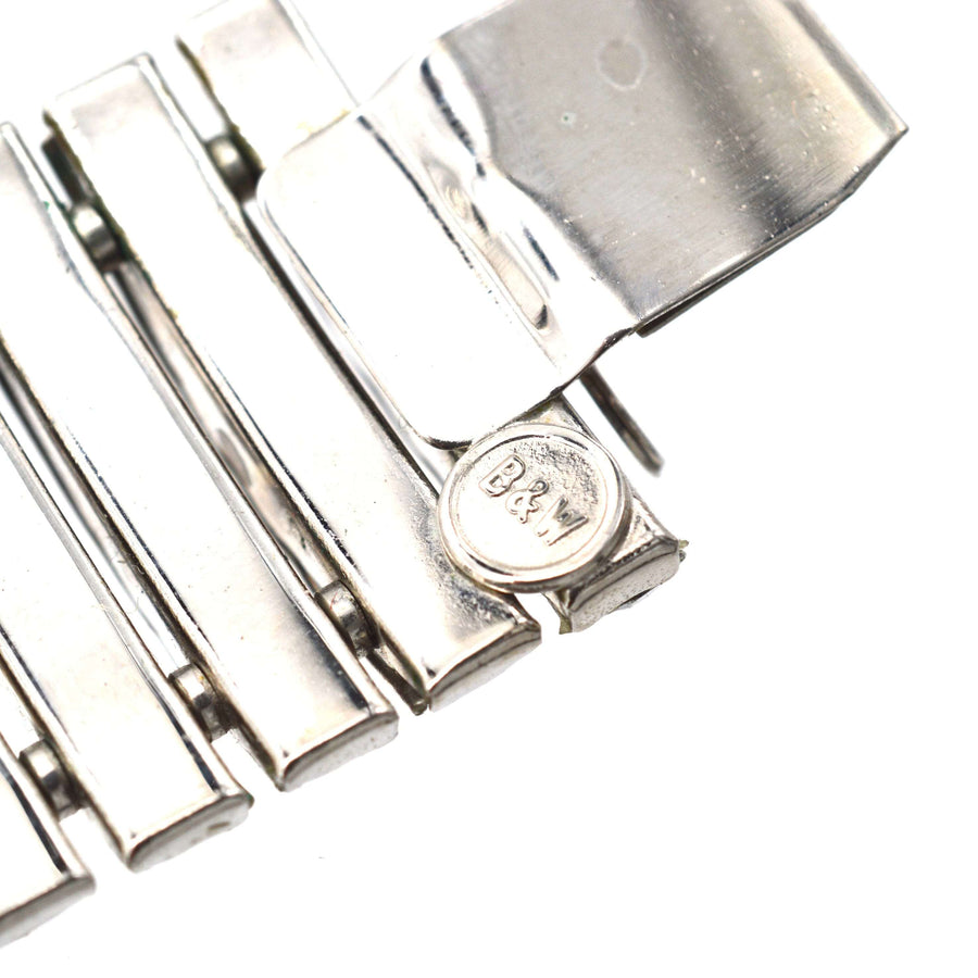 Close-up of Butler and Wilson 1980s crystal choker necklace clasp, showcasing detailed silver-tone design.