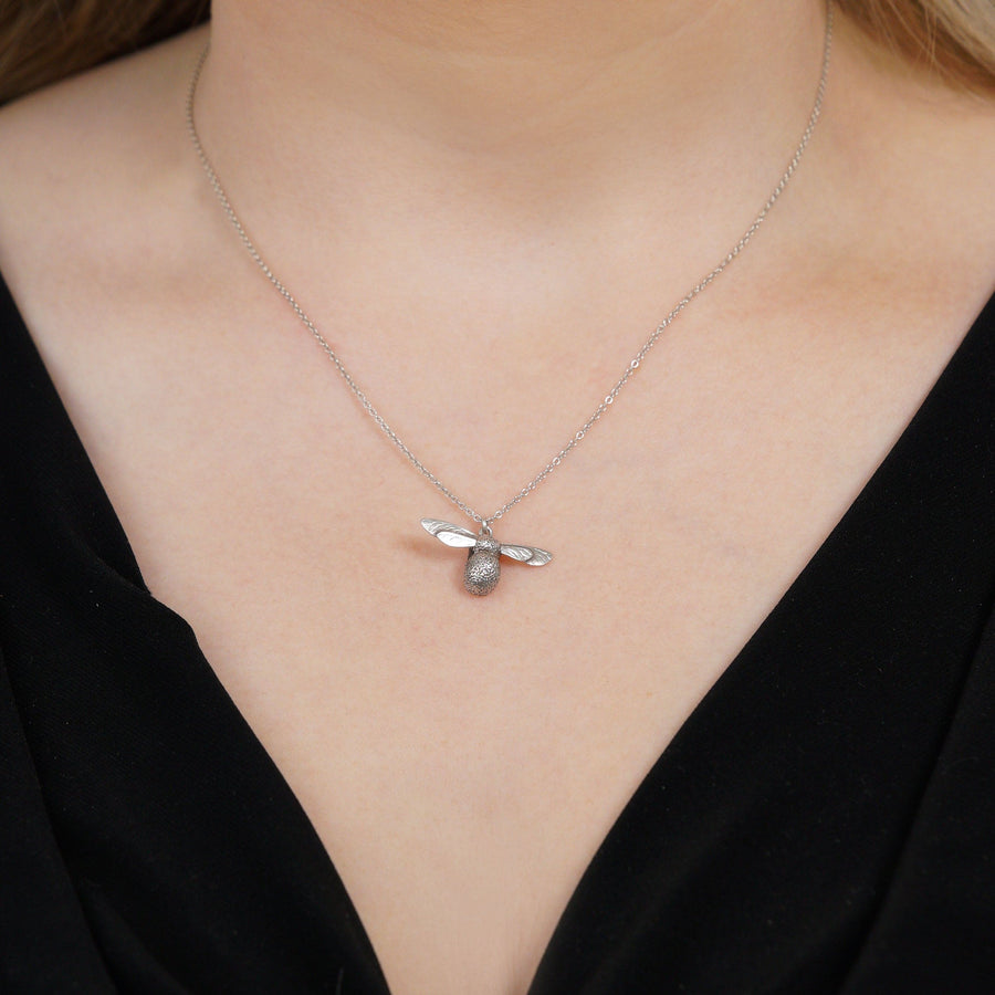 Silver bumblebee pendant necklace by Alex Monroe, showcasing delicate craftsmanship and nature-inspired design.