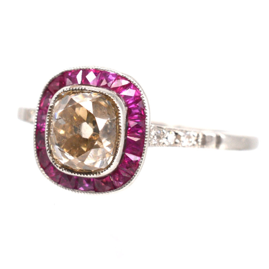 American Art Deco Platinum ring featuring 1.3 carat champagne diamond and ruby target design, perfect for engagement.
