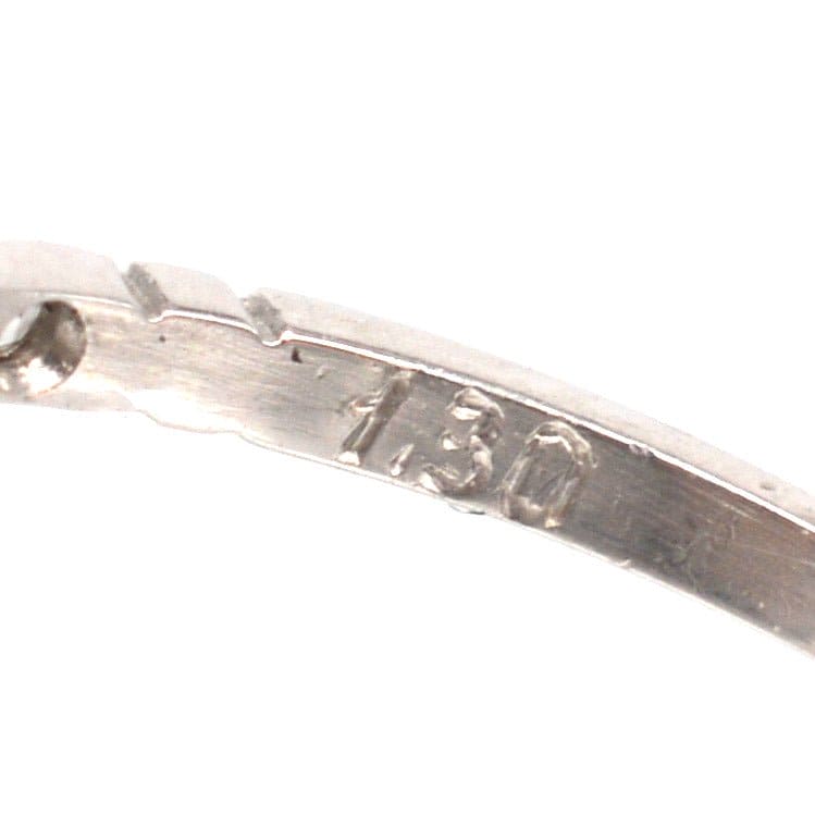 Detail of American Art Deco platinum ring with 1.3 carat marking, highlighting its craftsmanship and quality.