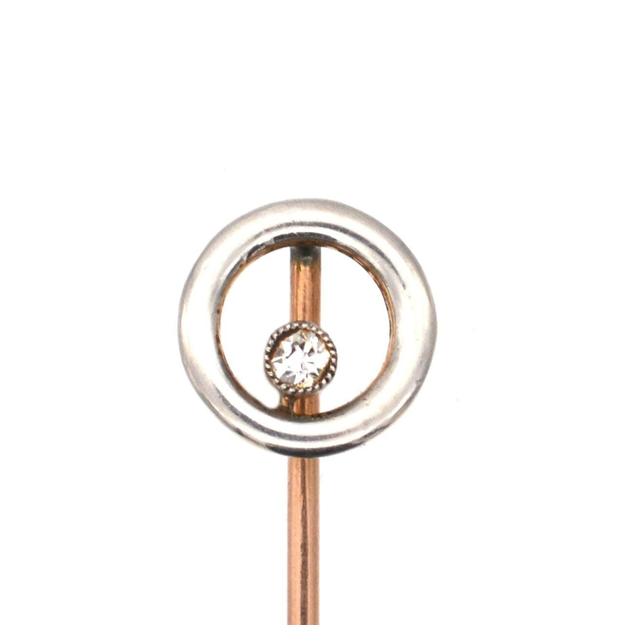 Art Deco 14ct gold and diamond circular tie pin featuring a chic design with a suspended diamond in a platinum circlet.