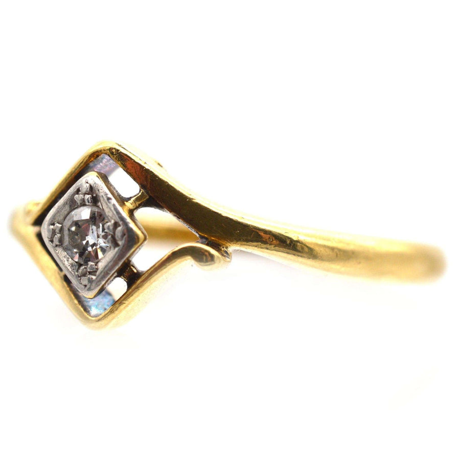 Art Deco 18ct gold and diamond solitaire twist ring featuring a unique design from the 1920s.