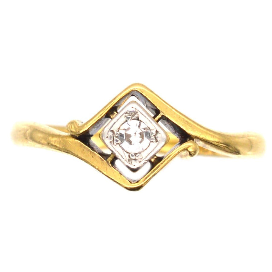 Art Deco 18ct gold diamond solitaire twist ring, circa 1920s, featuring elegant swirls in a unique design.
