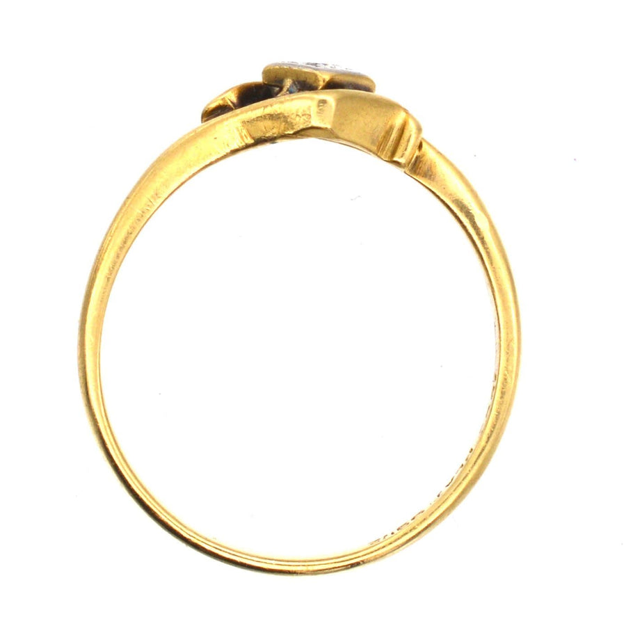 Art Deco 18ct gold diamond solitaire twist ring showcasing elegant gold swirls around the diamond, circa 1920s.