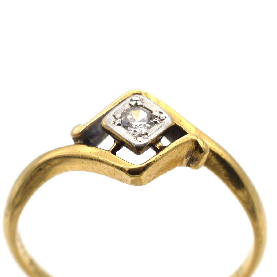 Art Deco 18ct gold and diamond solitaire twist ring, circa 1920s, elegant design with unique diamond shape frame.