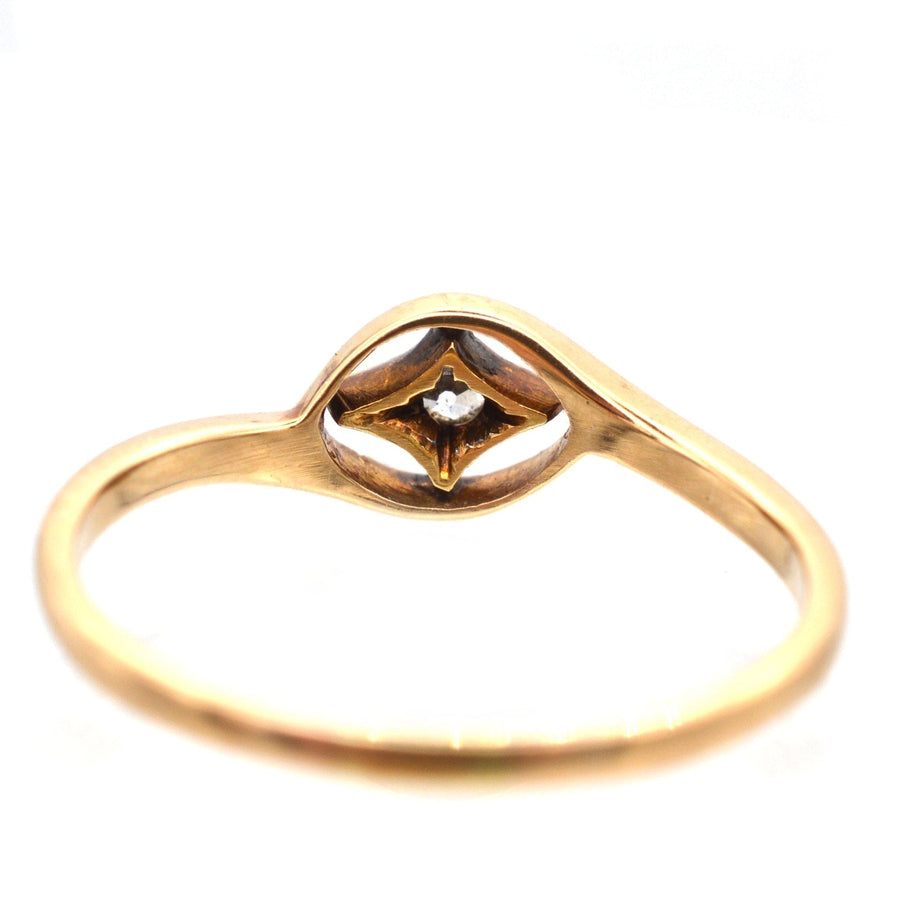 Art Deco 18ct gold diamond twist ring with star motif, showcasing exquisite craftsmanship in a geometric design.