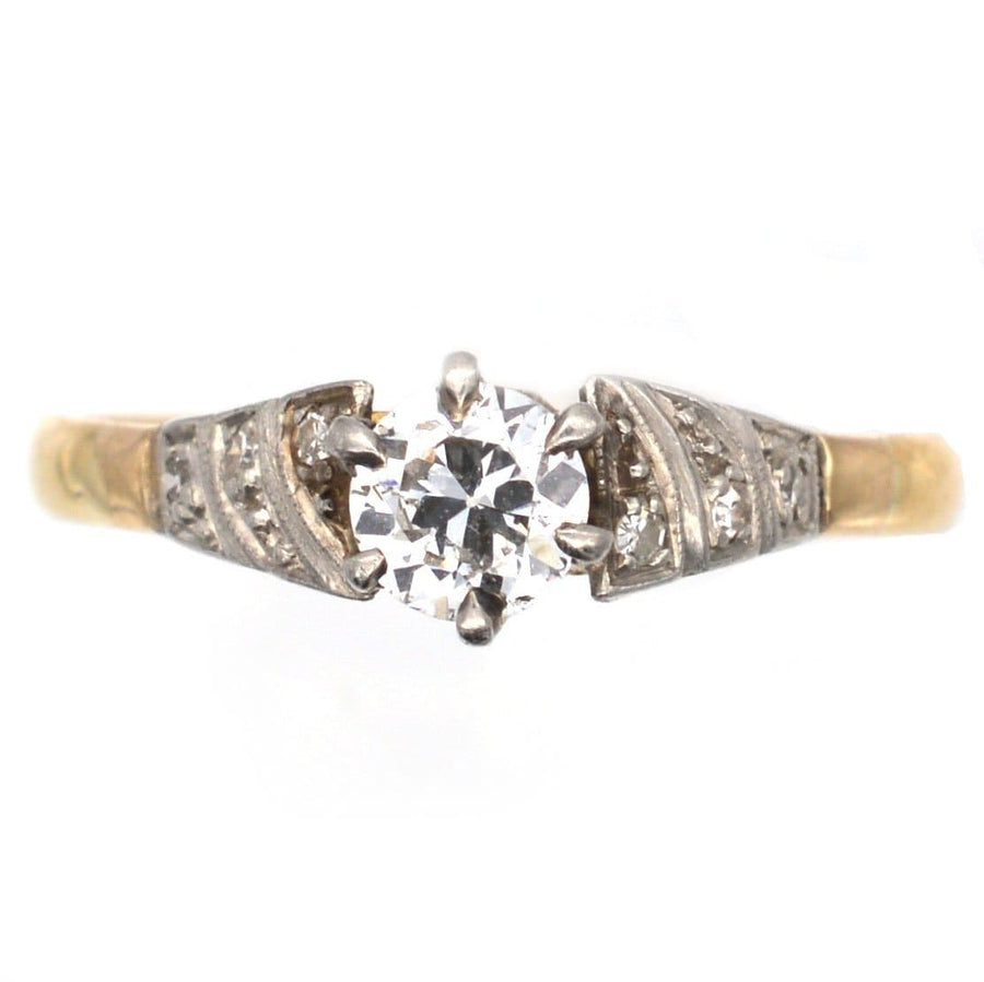 Art Deco 18ct gold diamond solitaire ring featuring a 0.35 carat center diamond with sparkling side accents.