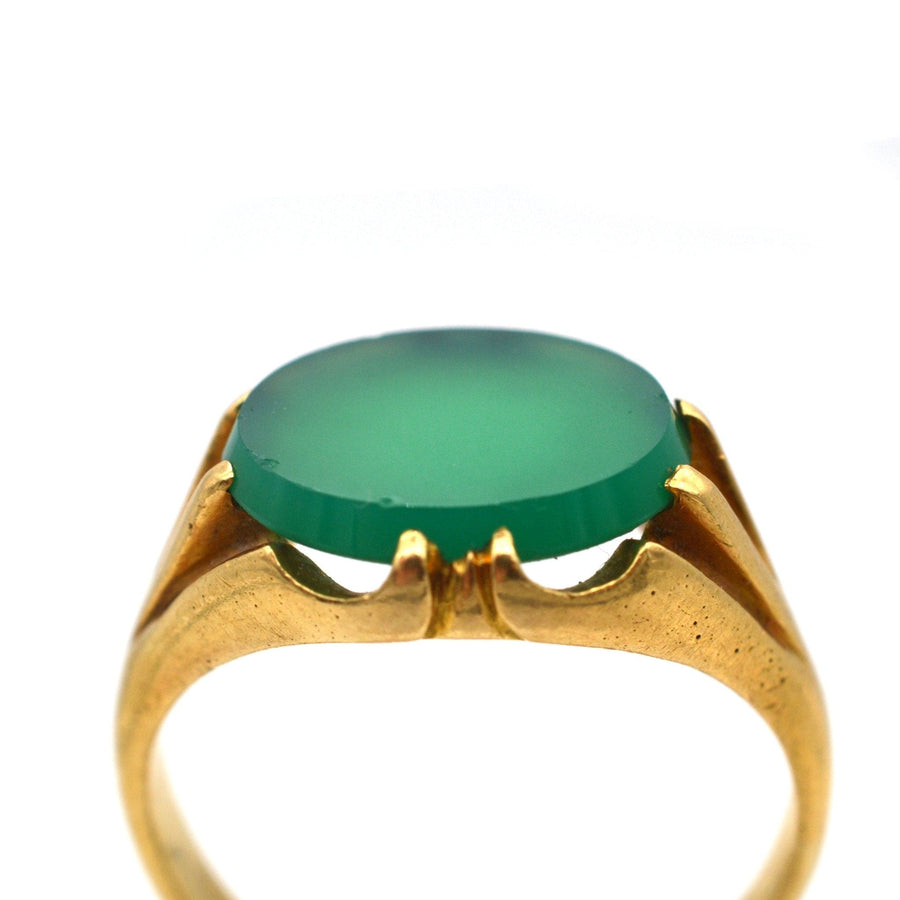 Art Deco 18ct gold signet ring featuring a rich green chalcedony stone, showcasing unique ridged shoulders.