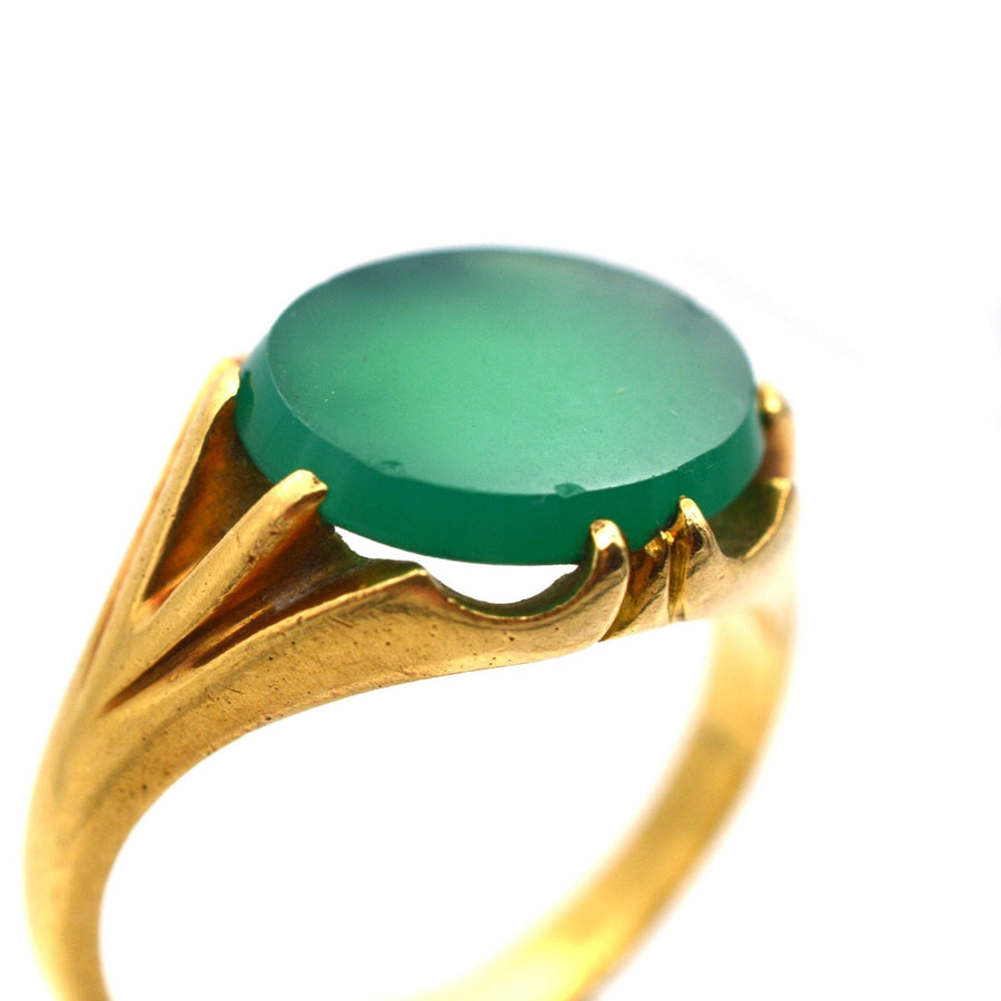 Art Deco 18ct gold signet ring featuring a rich green chalcedony stone with unique ridged shoulders.