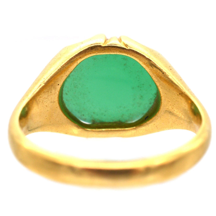 Art Deco 18ct gold signet ring featuring a rich green chalcedony stone with unique ridged shoulders.