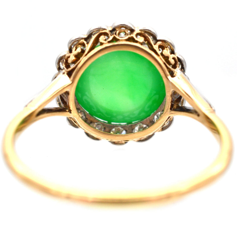 Art Deco 18ct gold ring featuring untreated imperial jadeite and diamond cluster, showcased in a stunning design.