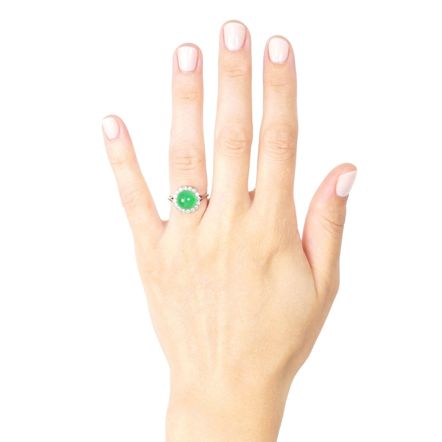 Art Deco 18ct gold ring featuring Grade A imperial jade and diamond cluster shown on a hand.