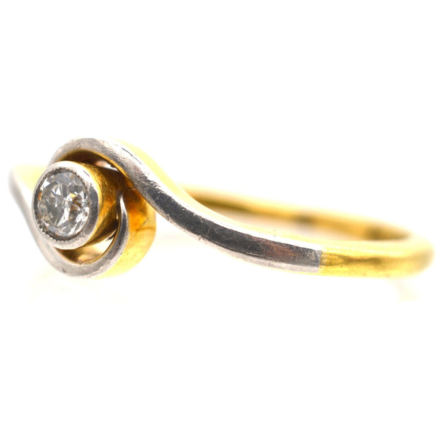 Art Deco 18ct gold and platinum twist solitaire ring with bezel-set diamond, perfect for everyday wear.
