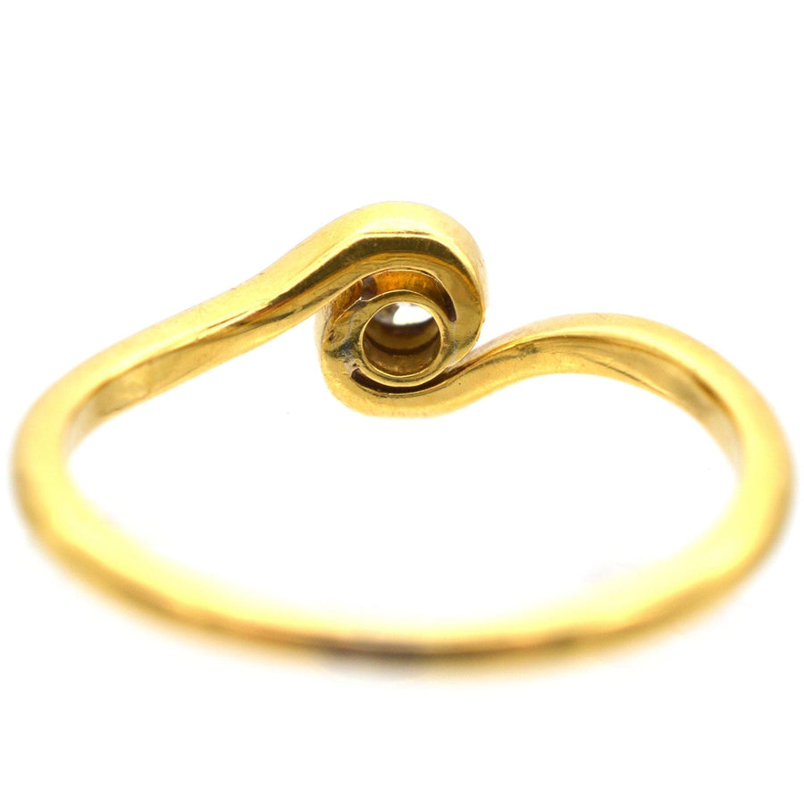 Art Deco 18ct gold twist solitaire ring featuring a low-profile bezel-set diamond for comfort and style.