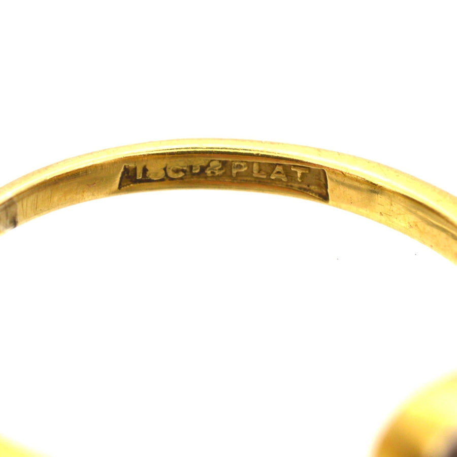 Inside view of an Art Deco ring showing the 18ct gold and platinum hallmark engraving.