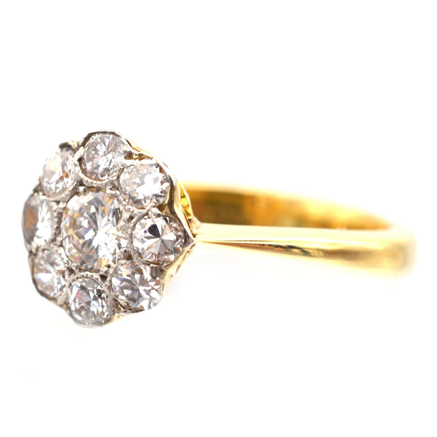 Art Deco 18ct gold and platinum diamond cluster ring, 1930s vintage style, featuring central 0.20ct diamond and 0.40ct surrounding diamonds.