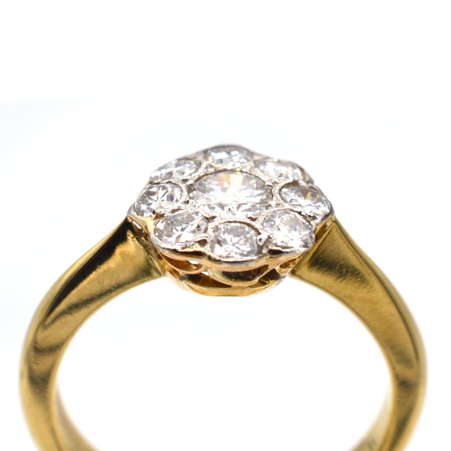 Art Deco 18ct gold and platinum diamond cluster ring, featuring 0.20ct center and 0.40ct surrounding diamonds, circa 1930s.