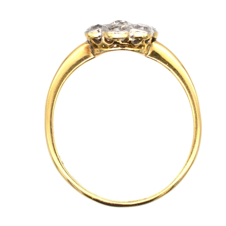 Art Deco 18ct gold and platinum diamond cluster ring featuring a central 0.20ct diamond with surrounding diamonds.