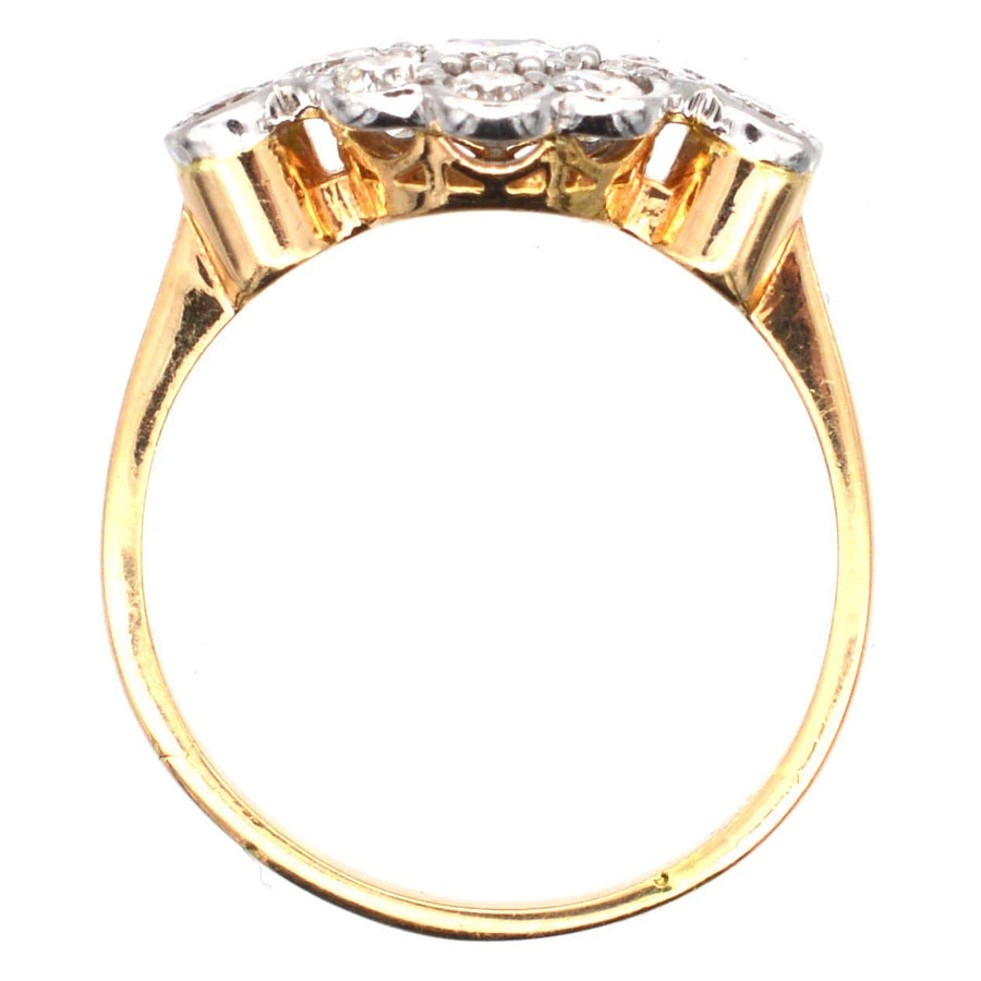 Art Deco 18ct gold and platinum diamond cluster ring, showcasing a central diamond with eight stones surrounding it.